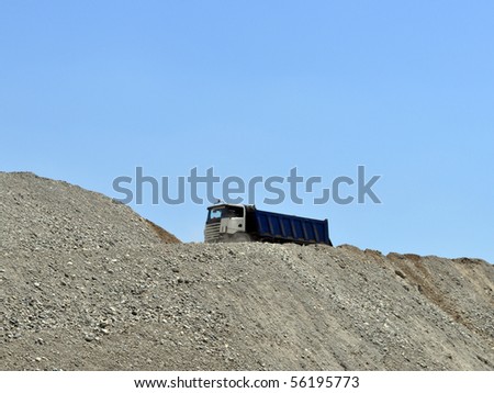 Truck on top of an earth mound