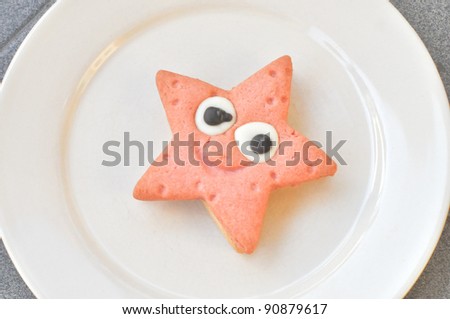 Home made star shaped strawberry and vanilla chocolate cookie in a dish