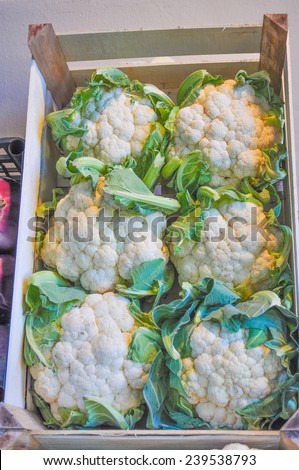 Cauliflowers vegetables in crate on a market shelf