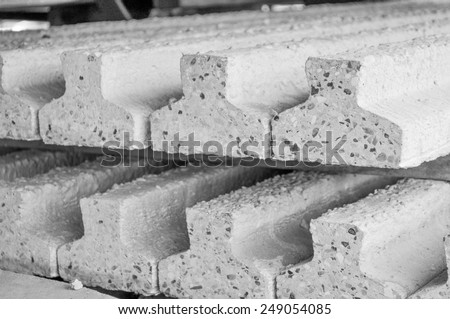 Prestressed precast pretensioned reinforced concrete beam in black and white