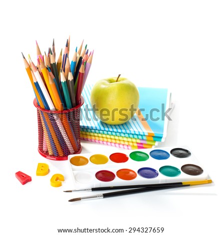 School equipment   with pencils, paints , brushes and apple isolated on white. Back to school concept.