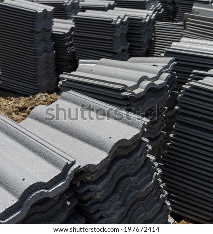 load of roofing tiles at a residential home construction site.
