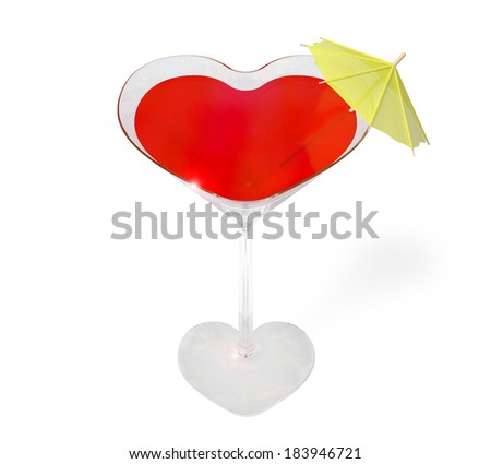 Glass in the form of heart with a red liquid and an umbrella on a white background