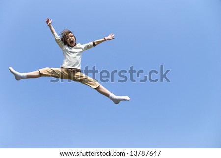 A girl jumps for joy with excitement.