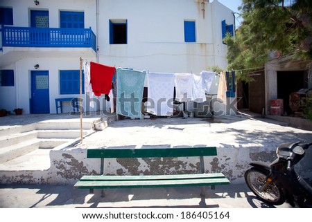 Laundry line with washed clothes outside a Greek island house in the Cyclades