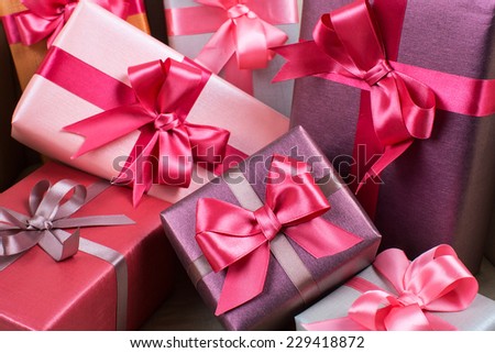 Stylishly packaged boxes with gifts closeup