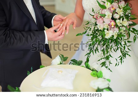 wedding ceremony, the bride and groom exchange rings. Details of the wedding day.