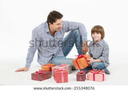 father gives gifts to his son. Isolated on white background