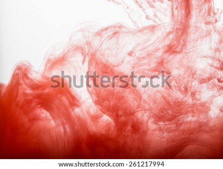 Abstract background. Red paint in water
