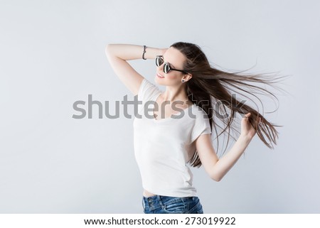 Brunette girl with fluttering hair with wind.