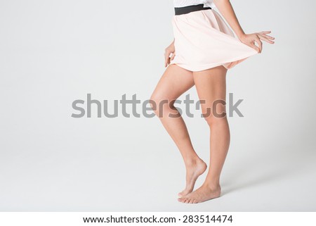 Attractive young legs in a skirt