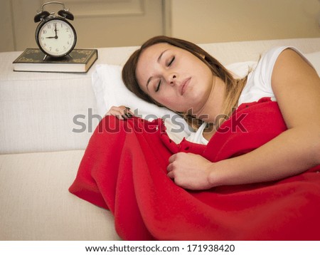 beautiful young woman sleeping in her bed