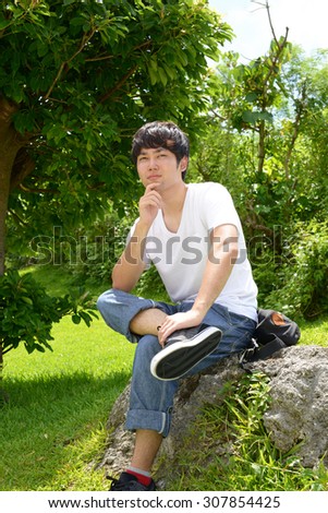 Relaxed young man at the park