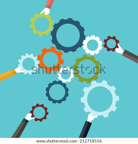 Concept of teamwork and integration with businessman holding colorful cogwheel Concept of teamwork and integration with businessman holding colorful cogwheel