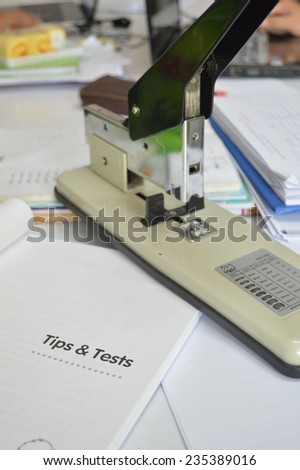 Handy stapler with paper work in the office