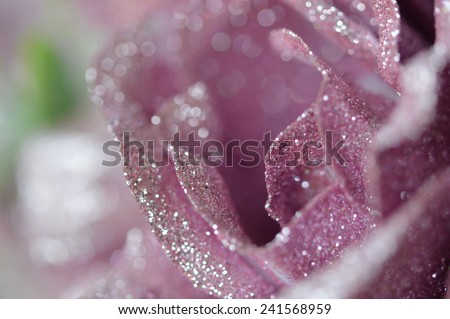 Hand made fabric and plastic flowers in purple color in the closeup picture