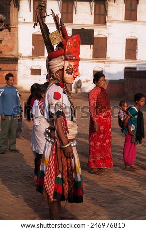 BHAKTAPUR, NEPAL - APRIL 19, 2013:Participants and spectators watch a ritual dance called Bhairav Dance in Bisket Jatra is  which is held during the celebration of Nepali New Year.