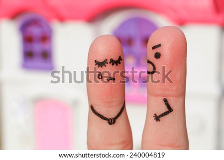 Finger art of a  couple during quarrel. A man yells at a woman. Woman crying.