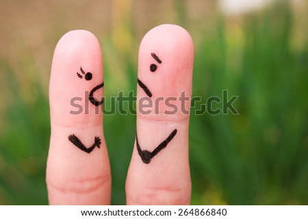 Finger art of a couple during quarrel. A woman yells at a man.