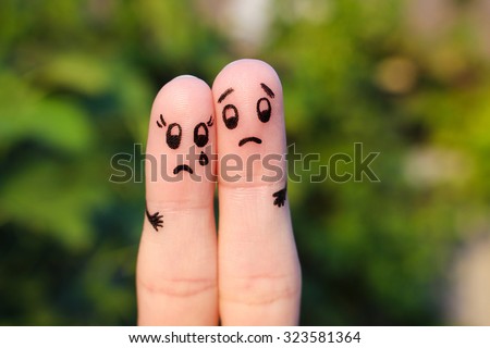 Finger art of  displeased couple. Sad man soothe woman, she\'s crying.