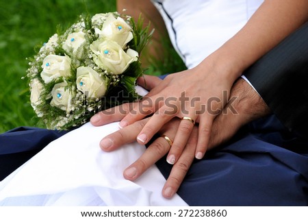 Hands of a married couple who gather with affection