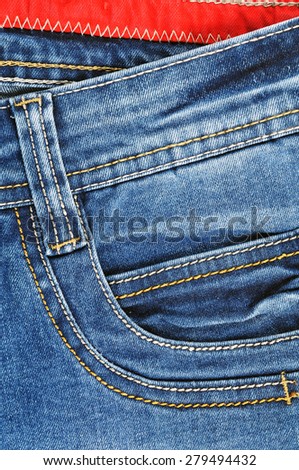 Detail of the front pocket of pants in jeans for men light blue color