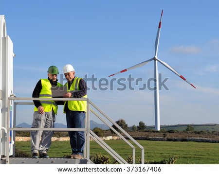 Technicians engaged in the detecting of a wind turbine installation for the production of energy