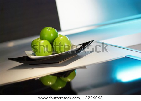 Granny smith apples on table in modern kitchen
