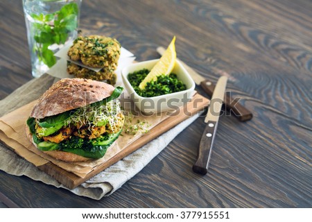 Healthy food: Vegan sourdough burger with sprouted greens and chickpea rissole