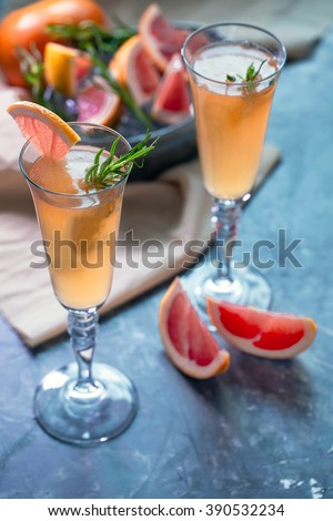 Grapefruit cocktail served in flute glasses.