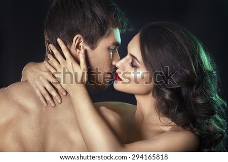 Kissing couple portrait.Sexy beauty couple.Portrait of happy loving couple.Pure passion.Sensual brunette woman in underwear with young lover, passionate couple foreplay closeup