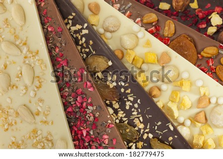Handmade white, milk and dark chocolate bars with a variety of dried fruit and nut toppings
