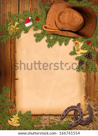 Christmas Western background with cowboy hat and old paper for text