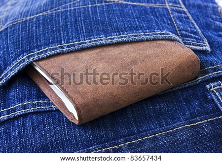 Leather wallet with money in blue jeans.Man\'s style life