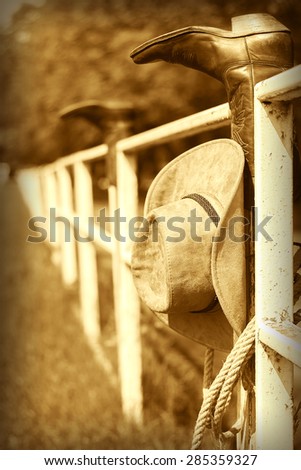 Vintage western ranch background with cowboy boots and hat