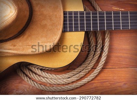 American Country music with guitar and cowboy hat and rope