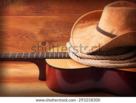 Country music picture with guitar and cowboy hat and lasso