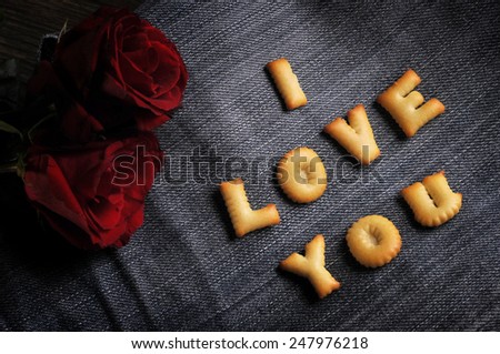 Cookies ABC in the form of word I LOVE YOU alphabet on old jean background, Valentines day