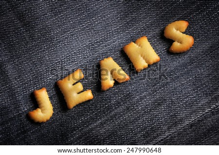 Cookies ABC in the form of word JEANS alphabet on old jean background, Valentines day