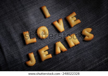 Cookies ABC in the form of word I LOVE JEANS alphabet on old jean background, Valentines day