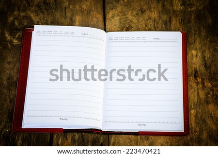 Notebook blank open for text on text old wood background