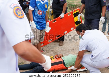 Chumpon, Thailand January 3 :Woman who accident by car was rescue by doctor and rescue on site of accident. Thailand on January 3, 2015