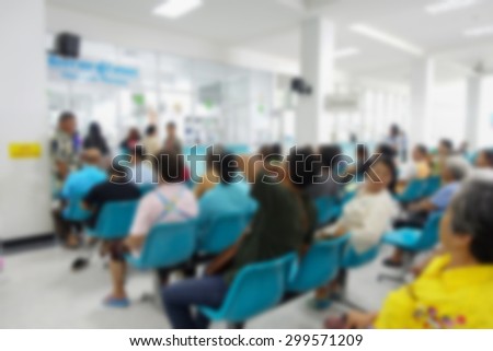 Blurred image of unidentified people and patient waiting doctor or medicine in hospital.