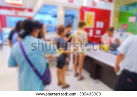 Blurred image of people shop at bakery shop to buy bread
