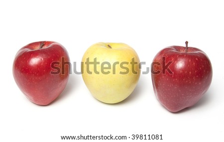 Be different - three red and yellow apples in a row