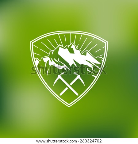 Template for logos labels and emblems with mountains two ice axes and sunbeams Vector illustration Template for logos labels and emblems with mountains two ice axes and sunbeams Vector illustration