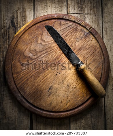 old knife on a wooden background