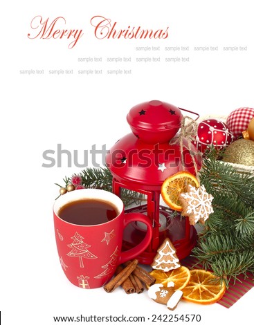Christmas background with a red mug, ginger cookies and dried oranges.