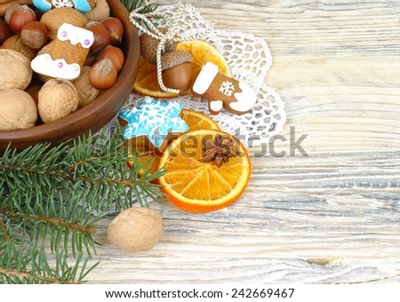 Christmas background with dried oranges and nuts.