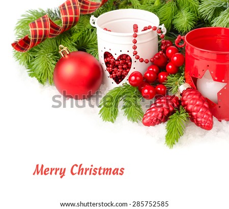 Red Christmas ball both red and white candlesticks on a white background. A Christmas background with a place for the text.